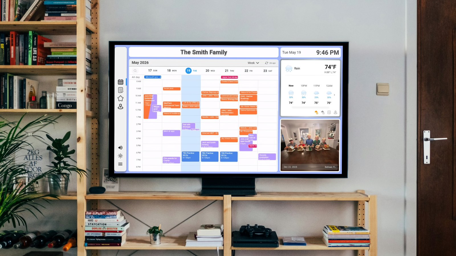 Dashie showing the family calendar, weather, and photos on a TV in a living room